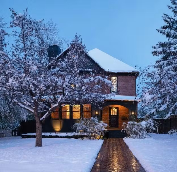 Street view of finished house in winter with heated sidewalk